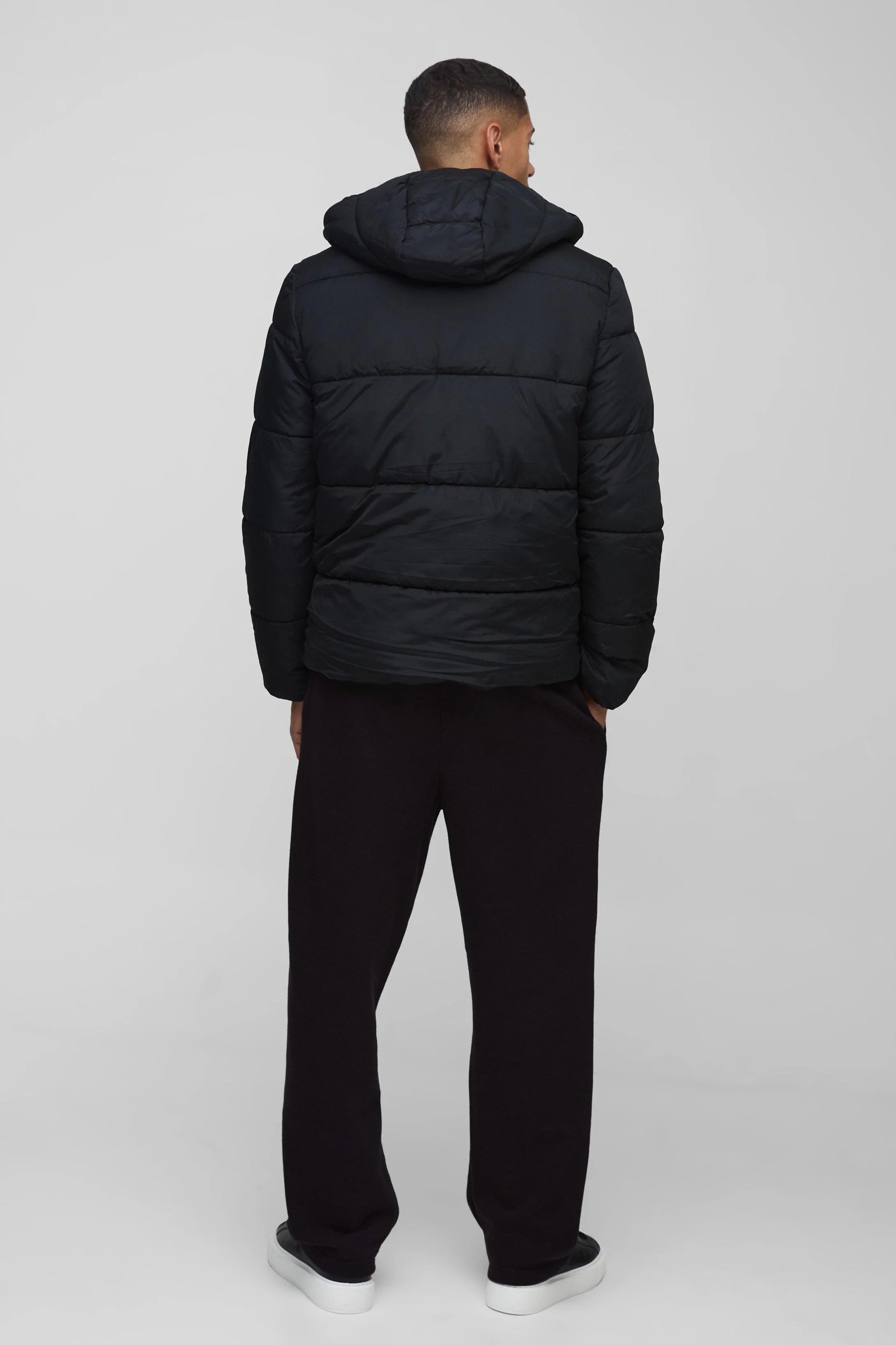 DOUDOUNE MATELASSÉE À CAPUCHE EN NOIR