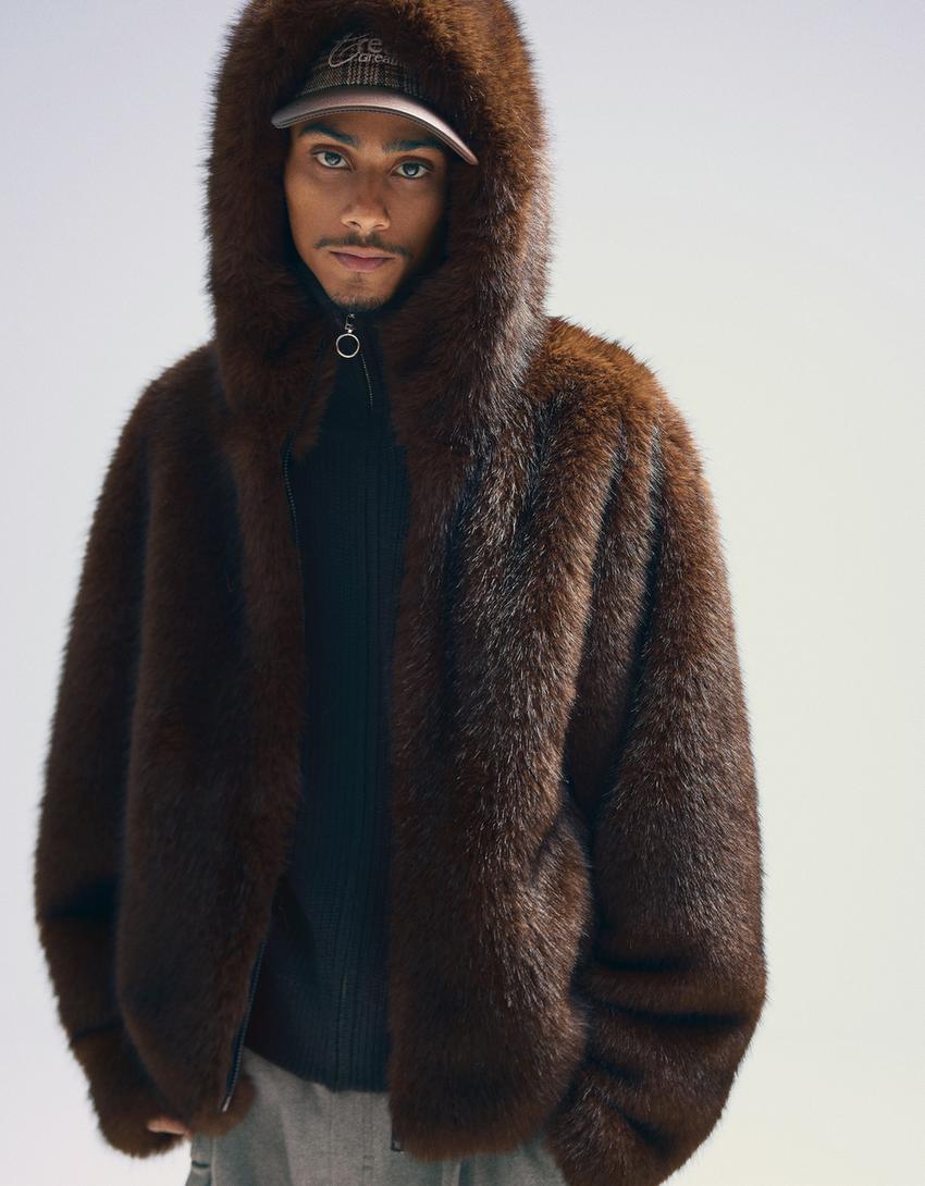 Blouson fausse fourrure à capuche