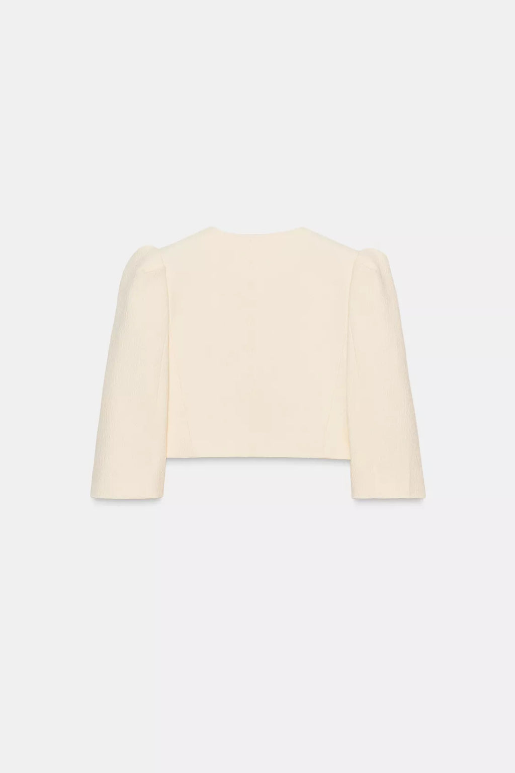 VESTE COURTE À MANCHES BOUFFANTES