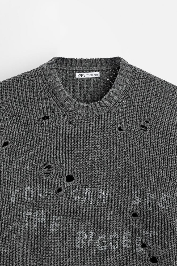 Pull effet déchiré imprimé